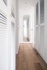 Modern home with Storage Room. An all-white walk-in closet design creates a brighter and more expansive perception of the space Photo 12 of Quarry Bay Residence