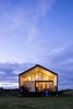 Modern home with Exterior, Metal Roof Material, Gable RoofLine, House Building Type, and Metal Siding Material. East Facade Photo 4 of House GM