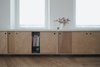 Modern home with Living Room and Bookcase. detail of custom made wooden furniture Photo 2 of Corner apartment in Strasbourg, France