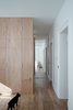 Modern home with Living Room and Medium Hardwood Floor. a mirror wall in the background Photo 4 of Corner apartment in Strasbourg, France