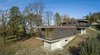 Modern home with Exterior, Concrete Siding Material, Brick Siding Material, Metal Siding Material, House Building Type, and Flat RoofLine. The volumes follow the natural topography of the site Photo 4 of Villa Rambo