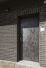Modern home with Doors, Metal, Swing Door Type, and Exterior. The main entrance door is coated with a “rusty brown” metal to merge wiht the dark brick facade. Photo 8 of Villa Rambo