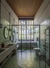 Modern home with Bath Room, Ceramic Tile Floor, Enclosed Shower, One Piece Toilet, Wall Lighting, Mosaic Tile Wall, Drop In Sink, Undermount Tub, Concrete Counter, Alcove Tub, Ceramic Tile Wall, Soaking Tub, and Full Shower. Estúdio Penha left industrial accents—like metallic frames, large windows, and cement tiles—in many rooms of Conde D'eu House. Photo 6 of Conde D'eu House
