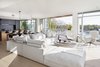 Modern home with Living Room, Light Hardwood Floor, and Ceiling Lighting. Impressive integrated kitchens feature an expansive centre island, designer Gaggenau and Miele appliances, under-mount Franke stainless steel sink, and sleek Dornbracht fixtures, creating a truly gourmet culinary experience. Photo 6 of Vancouver Features Ultra Luxury Rental at Eventide