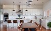 Modern home with Kitchen, Pendant Lighting, Subway Tile Backsplashe, Wall Oven, Range Hood, Medium Hardwood Floor, Recessed Lighting, Undermount Sink, Range, and Engineered Quartz Counter. Kitchen Photo 6 of OKC Farmhouse