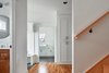Modern home with Hallway and Medium Hardwood Floor. Hallway from Kitchen Photo 9 of OKC Farmhouse