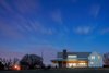 Modern home with Exterior, House Building Type, Gable RoofLine, Wood Siding Material, and Metal Roof Material. Back of the House at Dusk Photo 19 of OKC Farmhouse