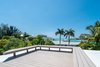 A spacious roof deck is the perfect vantage point for wondrous waterscapes and jaw-dropping nightly sunsets. Additionally, Lido Shores homeowners enjoy deeded access to a private beach. Photo 8 of STRANDHUS, A MODERN LIDO SHORES ESTATE modern home