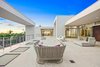 Modern home with Exterior, House Building Type, Boathouse Building Type, Beach House Building Type, and Flat RoofLine. Outside, multiple sun decks, a saltwater pool and several reflection pools are set against the breathtaking backdrop of Sarasota Bay. A boat dock and lift provide direct water access; on the Gulf side of the property, a private beach awaits. Photo 5 of Ultra-Contemporary Gulf-to-Bay Estate