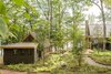 Modern home with Outdoor, Walkways, Trees, and Front Yard. Master Bedroom and Living Room Photo 2 of Camp on Long Lake