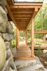 Modern home with Outdoor, Boulders, Walkways, and Wood Patio, Porch, Deck. Boardwalk at outdoor fireplace Photo 3 of Camp on Long Lake