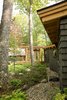 Modern home with Exterior, Wood Siding Material, Metal Roof Material, Cabin Building Type, Shed RoofLine, and Flat RoofLine. Cedar Shakes and Vertical Siding Photo 4 of Camp on Long Lake