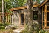 Modern home with Exterior, Cabin Building Type, Metal Roof Material, Wood Siding Material, Flat RoofLine, and Shed RoofLine. Kitchen and Boardwalk exterior view Photo 5 of Camp on Long Lake