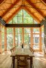 Modern home with Dining Room, Ceiling Lighting, and Wall Lighting. Screen Porch Photo 8 of Camp on Long Lake