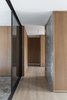 Modern home with Hallway and Medium Hardwood Floor. The smoked glass sliding door Photo 4 of House A326