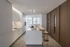 Modern home with Kitchen, Wood Counter, Cooktops, White Cabinet, Dishwasher, Wine Cooler, Marble Floor, Wall Oven, Refrigerator, Wood Cabinet, and Ceiling Lighting. Kitchen Bulthaup and marble floor Photo 8 of House A326