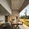 Modern home with Dining Room, Table, Chair, and Concrete Floor. RF Residence takes inspiration from the work of Donald Judd, says JSa Arquitectura. An expansive patio allows residents to soak in the views while dining alfresco. Photo 7 of RF Residence
