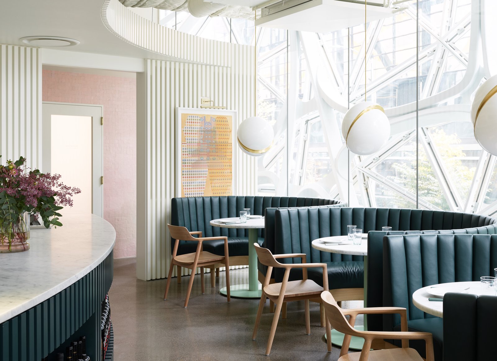 The deconstructed globe pendants pay homage to the Sphere's dome shape.