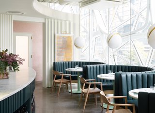 The deconstructed globe pendants pay homage to the Sphere's dome shape.