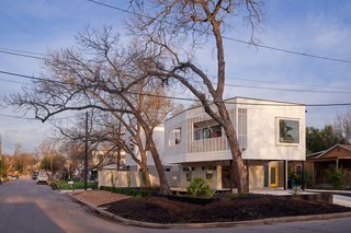 The project's prime, corner lot real estate dictated the organization of the separate living quarters. The main house's driveway and entryway, for example, are located on Maude Street, giving permanent residents a sense of privacy.