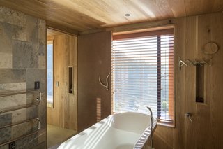 Thoughtful touches, like a spacious standalone bathtub, turn this retreat into a peaceful escape.