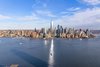 Floor-to-ceiling windows frame dramatic vistas of the Manhattan skyline, World Trade Center, New York Harbor and Statue of Liberty. Photo 7 of 99 Hudson modern home