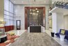 The Enclave features a full suite of resort-style indoor and outdoor amenities that were curated to create an exceptional urban lifestyle experience, including a welcoming lobby with 24-hour concierge service. Photo 2 of The Enclave modern home