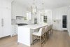 Modern home with Kitchen, Marble Counter, Beverage Center, Wall Oven, Range Hood, Stone Slab Backsplashe, Light Hardwood Floor, Wine Cooler, Microwave, Refrigerator, Undermount Sink, Range, Ceiling Lighting, White Cabinet, Pendant Lighting, Recessed Lighting, and Dishwasher. Kitchen Photo 4 of The Piano Estate
