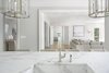 Modern home with Kitchen, Marble Counter, White Cabinet, Stone Slab Backsplashe, Light Hardwood Floor, and Ceiling Lighting. Kitchen looking across house Photo 5 of The Piano Estate