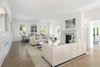 Modern home with Living Room, Two-Sided Fireplace, Gas Burning Fireplace, Light Hardwood Floor, Sofa, Wall Lighting, and Ceiling Lighting. Formal Living Room Photo 6 of The Piano Estate