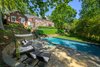 Modern home with Outdoor, Back Yard, Landscape Lighting, Trees, Grass, Shrubs, Large Patio, Porch, Deck, Large Pools, Tubs, Shower, Hardscapes, and Swimming Pools, Tubs, Shower. Rear Exterior Photo 9 of The Piano Estate