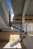 Modern home with Staircase, Metal Tread, and Metal Railing. While the light-filled Chojamaru View Terrace features an unassuming concrete facade, Endo Architect and Associates carefully designed each unit of the project to have spacious interiors. The delicate staircases are sturdy but unobtrusive. Photo 4 of Chojamaru View Terrace
