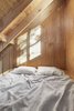 Modern home with Bedroom and Bed. The bed is suspended in the cathedral ceiling, overlooking the cabin. Photo 10 of La Pointe by L'Abri
