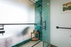 Modern home with Bath Room, Ceramic Tile Wall, Vessel Sink, Full Shower, Enclosed Shower, Ceramic Tile Floor, Recessed Lighting, Granite Counter, and One Piece Toilet. Modern, accessible shower featuring Mercury Mosaics handmade tile. Photo of Maui Modern, Budget-Luxury Remodeled Vacation Rental