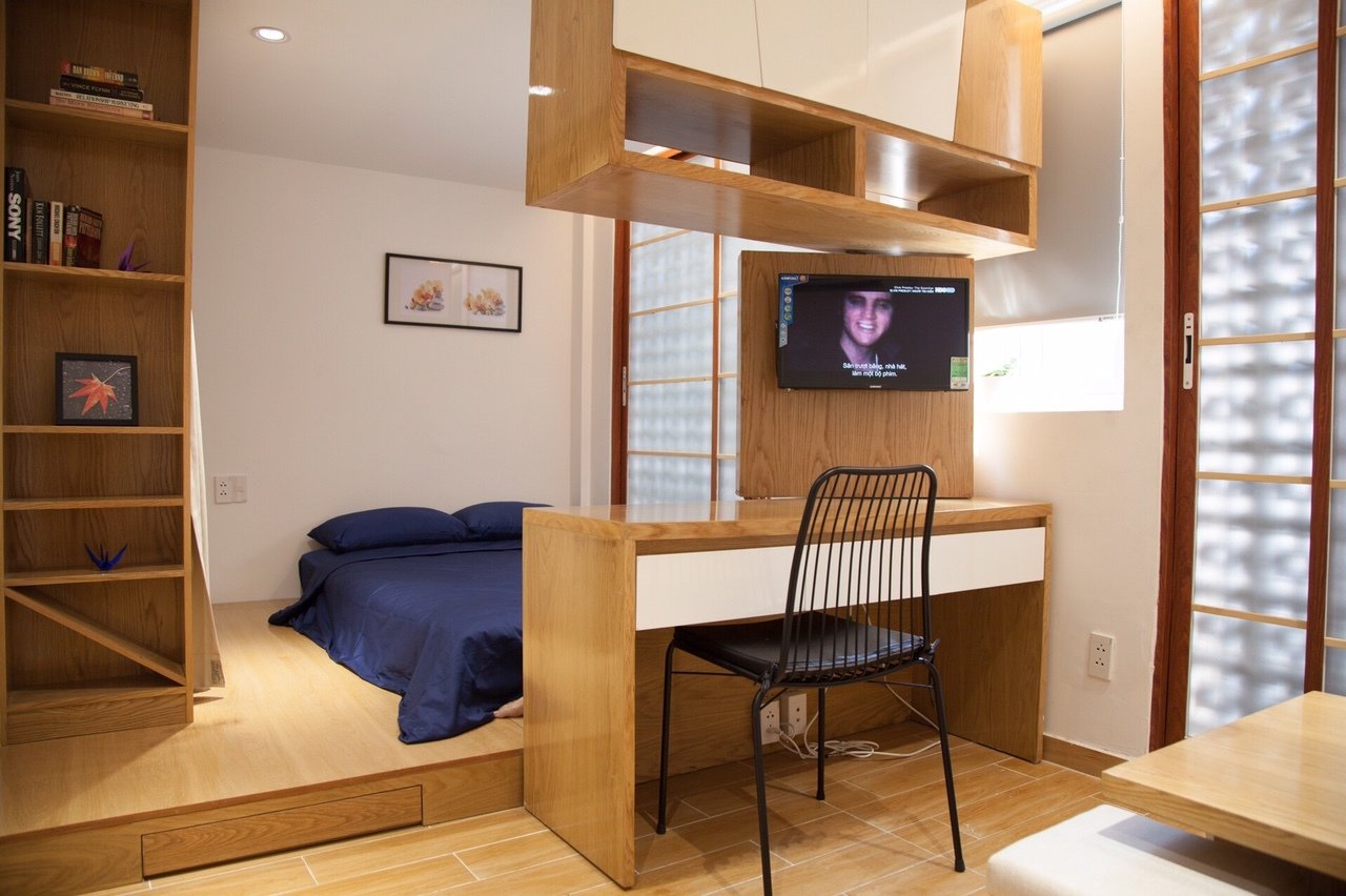 Cozy compact studio with living space, working space, private kitchen and bathroom. 
