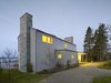 Modern home with Exterior, Metal Roof Material, Stone Siding Material, Gable RoofLine, Wood Siding Material, and House Building Type. North elevation Photo 11 of Bay of Fundy house