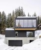 Modern home with Exterior, House Building Type, Concrete Siding Material, Glass Siding Material, Flat RoofLine, and Wood Siding Material. Street view Photo of Gilbert House