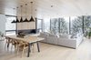 Modern home with Dining Room, Light Hardwood Floor, Chair, Table, Ceiling Lighting, and Pendant Lighting. Open living and dining areas on upper floor Photo 2 of Gilbert House