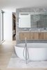 Modern home with Bath Room, Marble Wall, Light Hardwood Floor, Undermount Sink, Marble Floor, Ceiling Lighting, Accent Lighting, and Freestanding Tub. Master bath tub is open to the master bedroom. Photo 8 of Gilbert House