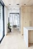 Modern home with Hallway and Light Hardwood Floor. Framed view of birch trees through family room Photo 6 of Gilbert House