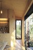 Modern home with Ceiling Lighting, Wall Lighting, Light Hardwood Floor, and Chair. Light pine finishes make the interiors feel airy and spacious. Photo 12 of heva