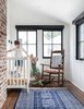 Modern home with Bedroom, Rockers, Medium Hardwood Floor, and Recessed Lighting. The baby's room is light and airy thanks to it being converted from an old, unloved sun porch. We uncovered the original brick flute during the remodel and kept it for an interesting architectural element. Photo 3 of Modern Spanish Revival