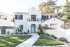 Modern home with Exterior, Tile Roof Material, House Building Type, Stucco Siding Material, and Gable RoofLine. The Dobrinski's 1930s Spanish Revival in Land Park Photo 4 of Modern Spanish Revival