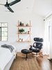 Modern home with Bedroom, Medium Hardwood Floor, Chair, Bed, Shelves, and Recessed Lighting. A cozy reading nook in the master bedroom. Photo 5 of Modern Spanish Revival