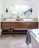 Modern home with Bath Room, Ceramic Tile Floor, Recessed Lighting, and Wall Lighting. A custom built walnut bathroom console sits adjacent to a standalone soaking tub in the master bathroom. Photo 11 of Modern Spanish Revival