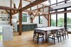 Modern home with Dining Room, Stools, Table, Chair, Recessed Lighting, Pendant Lighting, and Medium Hardwood Floor. The dining room of The Barn by La Firme Photo 9 of The Barn