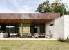Modern home with Outdoor, Field, Front Yard, Gardens, Grass, Shrubs, and Garden. Fachada Photo 5 of Entremuros House