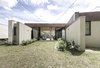 Modern home with Outdoor, Grass, Shrubs, Small Patio, Porch, Deck, and Gardens. Fachada Photo 11 of Entremuros House