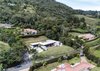 Modern home with Exterior, Metal Roof Material, House Building Type, Flat RoofLine, and Stone Siding Material. Aerial Photo 8 of Entremuros House