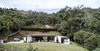 Modern home with Exterior, Stone Siding Material, House Building Type, Metal Roof Material, and Flat RoofLine. Fachada Photo 13 of Entremuros House